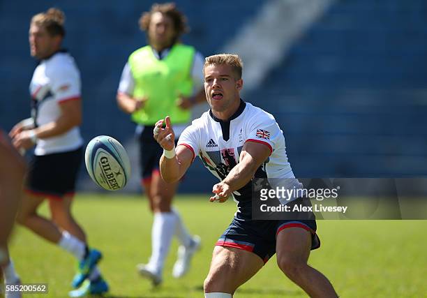 Tom Mitchell passes the ball during the Great Britain Rugby 7's training session at Cruzeiro FC on August 1, 2016 in Belo Horizonte, Brazil.