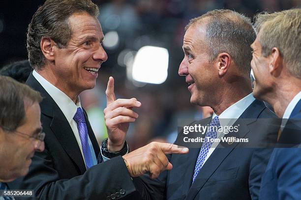 Gov. Andrew Cuomo, left, talks with Rep. Sean Patrick Maloney, D-N.Y., and his husband Randy Florke, on the floor of the Wells Fargo Center in...