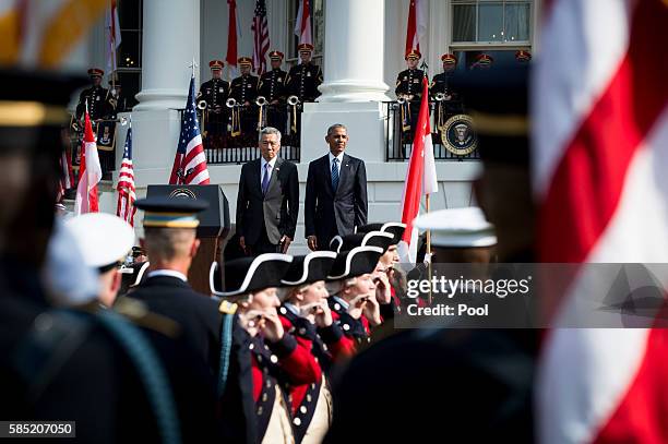 President Barack Obama and Prime Minister Lee Hsien Loong of Singapore during official welcoming ceremonies on the South Lawn of the White House on...