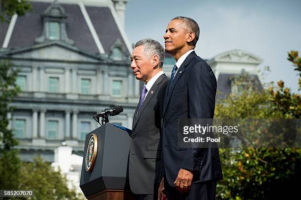 President Barack Obama and Prime Minister Lee Hsien Loong of Singapore during official welcoming ceremonies on the South Lawn of the White House on...