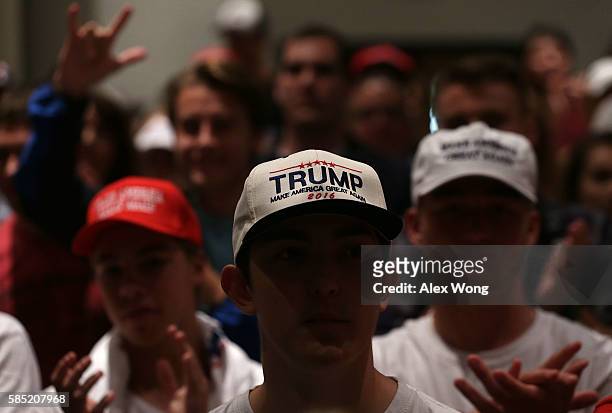 Supporters of Republican presidential nominee Donald Trump listen to his stump speech during a campaign event at Briar Woods High School August 2,...