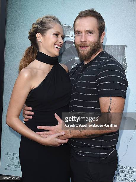 Actors Teresa Palmer and Mark Webber arrive at the premiere of New Line Cinema's 'Lights Out' at TCL Chinese Theatre on July 19, 2016 in Hollywood,...