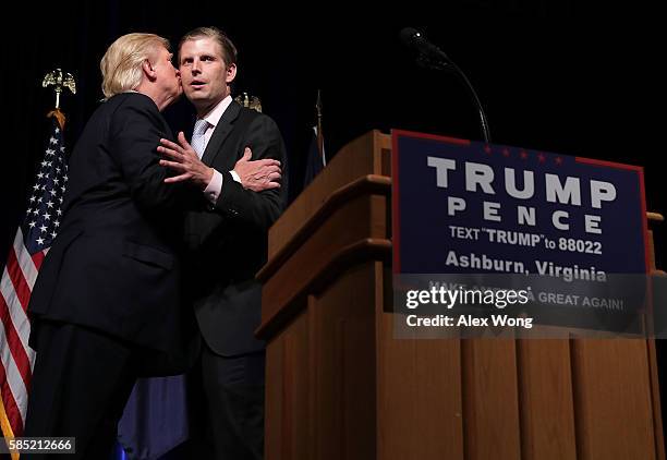 Republican presidential nominee Donald Trump kisses his son Eric Trump during a campaign event at Briar Woods High School August 2, 2016 in Ashburn,...