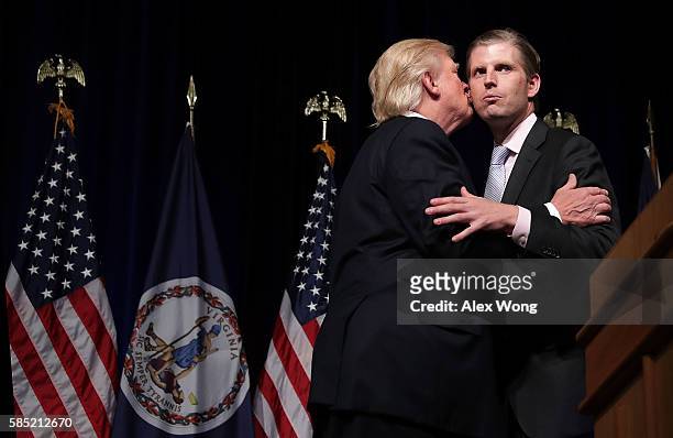 Republican presidential nominee Donald Trump kisses his son Eric Trump during a campaign event at Briar Woods High School August 2, 2016 in Ashburn,...
