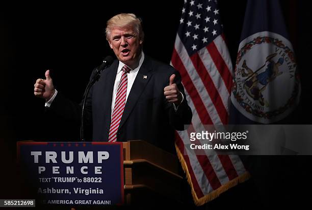 Republican presidential nominee Donald Trump holds two thumbs up during a campaign event at Briar Woods High School August 2, 2016 in Ashburn,...