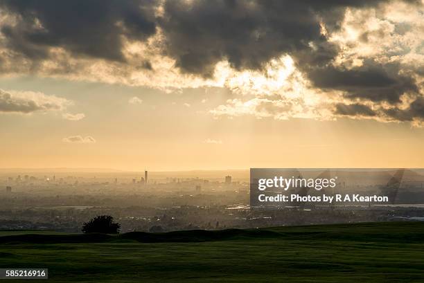 the city of manchester seen from a distant hilltop - manchester skyline stock pictures, royalty-free photos & images