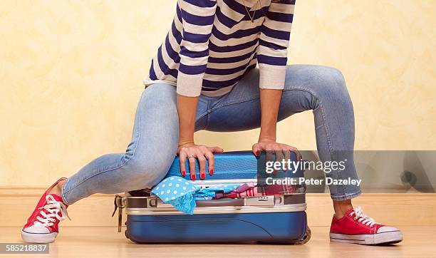 packing for vacation - packing suitcase stock pictures, royalty-free photos & images