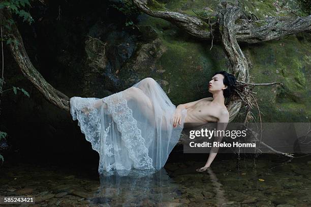 androgynous asian man - androgynous stock pictures, royalty-free photos & images
