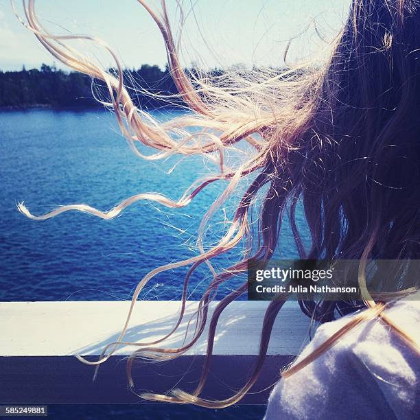 girl on ferry with hair blowing - manitoulin stock pictures, royalty-free photos & images