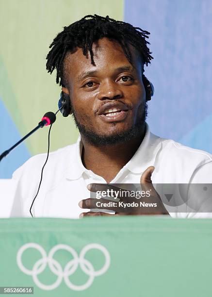 Popole Misenga, a refugee from the Democratic Republic of the Congo living in Brazil, speaks in a press conference in Rio de Janeiro on July 30,...