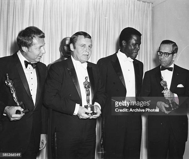 Actor Sidney Poitier , Oscar winner for his role in 'Lilies of the Field', with three other winners at the 36th Academy Awards, Los Angeles, April...