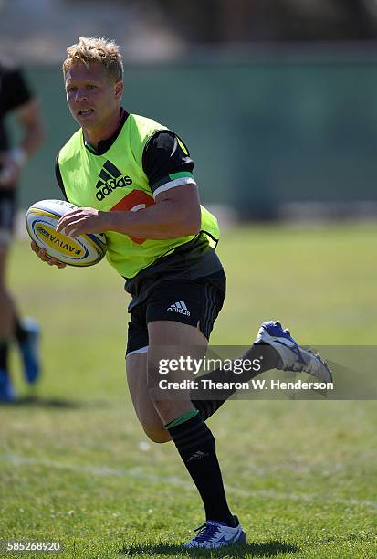 Matt Hopper center of Harlequins runs with the ball during a team practice at San Francisco Golden Gate RFC on August 2, 2016 in San Francisco,...