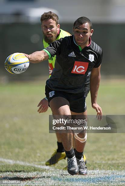 Joe Marchant center of Harlequins passes the ball during a team practice at San Francisco Golden Gate RFC on August 2, 2016 in San Francisco,...