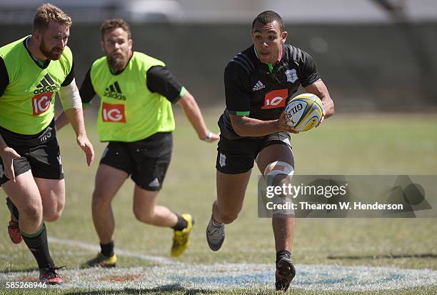 Joe Marchant center of Harlequins passes the ball during a team practice at San Francisco Golden Gate RFC on August 2, 2016 in San Francisco,...