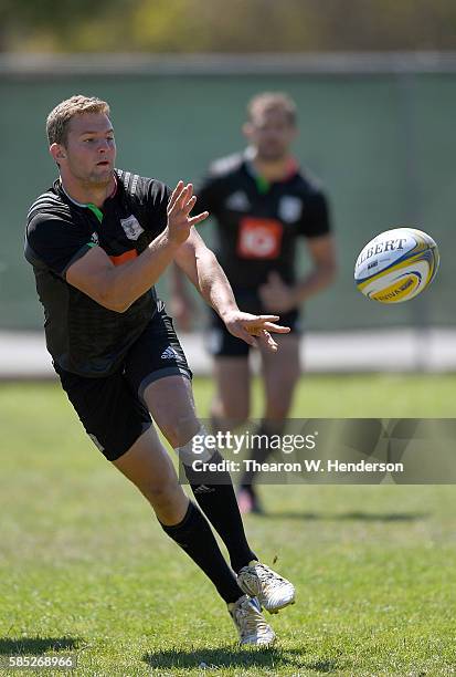 Charlie Mulchrone scrum half of Harlequins passes the ball during a team practice at San Francisco Golden Gate RFC on August 2, 2016 in San...