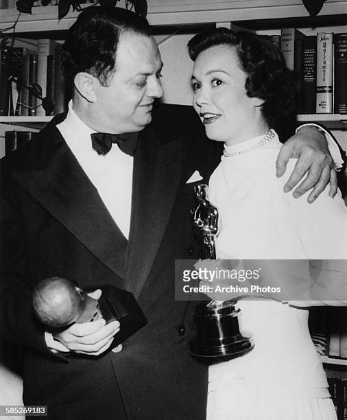 Actress Jane Wyman holding her Best Actress Oscar for the film 'Johnny Belinda' and producer Jerry Wald holding his Irving G Thalberg Memorial Award...