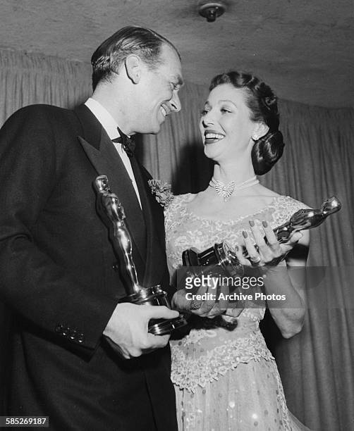 Actor Douglas Fairbanks Jnr accepting the Oscar for his friend Sir Laurence Olivier, from Loretta Young, at the 21st Academy Awards, Los Angeles,...