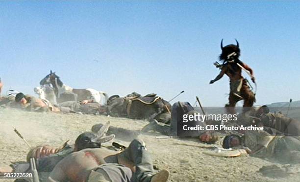 Theatrical movie originally released December 23, 1970. The film directed by Arthur Penn. Pictured, Cal Bellini approaches among the dead and wounded...