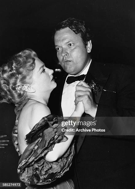 Actress Anne Baxter and director Orson Welles dancing together at the Cannes Film Festival, April 16th 1953.