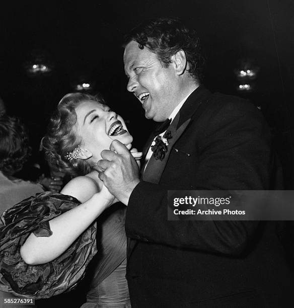 Actors Anne Baxter and Orson Welles dancing together at the Canned Film Festival, April 16th 1953.