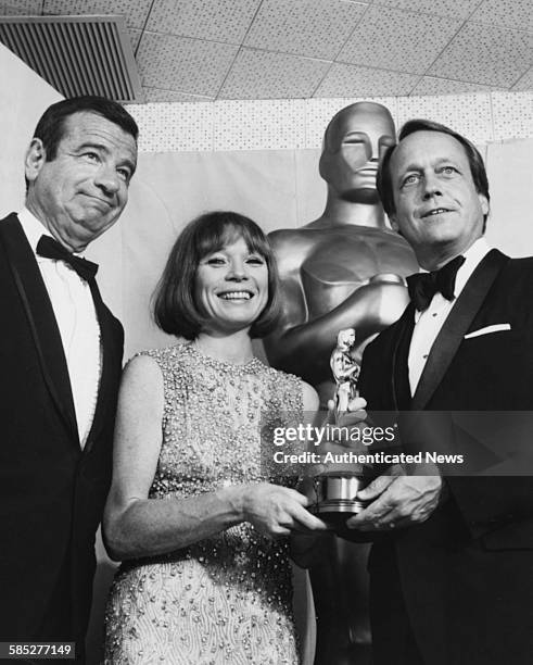 Director George Roy Hill holding hid Best Director Oscar for the film 'The Sting', with presenters Walter Matthau and Shirley MacLaine, at the 46th...