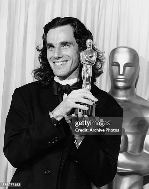 Actor Daniel Day Lewis holding his Best Actor Oscar for the film 'My Left Foot', at the 62nd Academy Awards, Los Angeles, March 26th 1990.