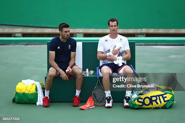 Colin Fleming and Andy Murray of Great Britain are seen during a practice session ahead of the Rio 2016 Olympic Games at the Olympic Tennis Centre on...