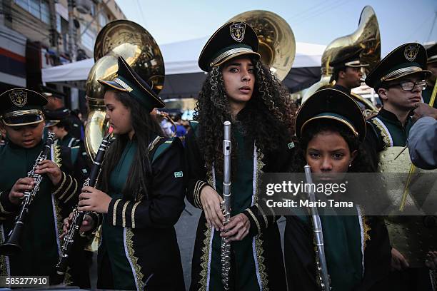 Band members wait to perform before the arrival of the Olympic torch ahead of the Rio 2016 Olympic Games on August 2, 2016 in Sao Goncalo, Rio de...