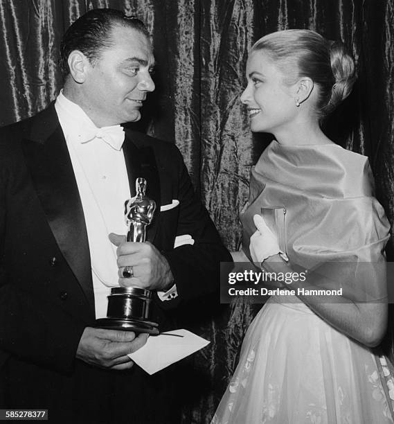 Actor Ernest Borgnine holding his Best Actor Oscar for the film 'Marty', with presenter Grace Kelly, at the 28th Academy Awards, Los Angeles, March...