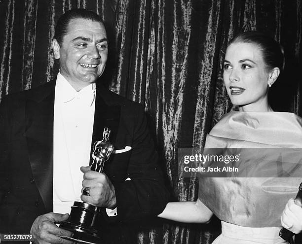 Actor Ernest Borgnine holding his Best Actor Oscar for the film 'Marty', with presenter Grace Kelly, at the 28th Academy Awards, Los Angeles, March...