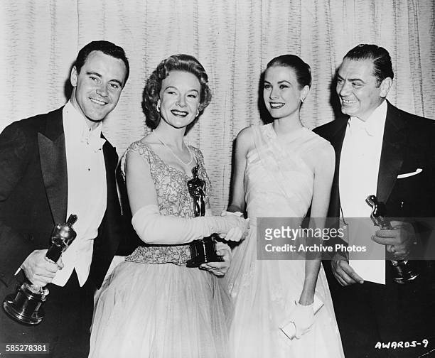Actors Jack Lemmon , Jo Van Fleet and Ernest Borgnine holding their Oscars, with presenter Grace Kelly , at the 28th Academy Awards, Los Angeles,...
