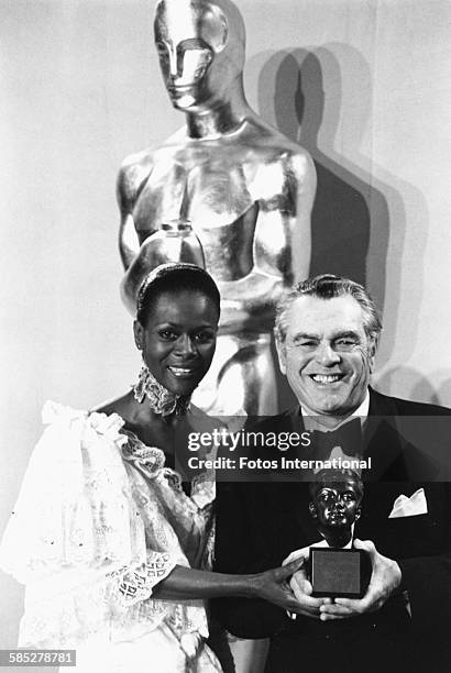 Pandro S Berman holding his Irving G Thalberg Memorial Award, with presenter Cicily Tyson, at the 49th Academy Awards, Los Angeles, March 28th 1977.