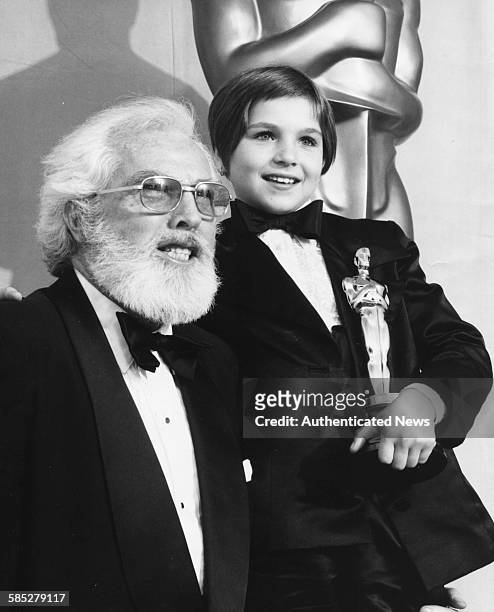 Child actress Tatum O'Neal holding her Best Supporting Actress Oscar, with her grandfather Charles O'Neal, at the 46th Academy Awards, Los Angeles,...