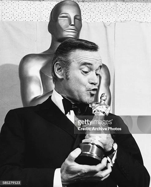Actor Jack Lemmon kissing his Best Actor Oscar, for the film 'Save the Tiger', at the 46th Academy Awards, Los Angeles, April 2nd 1974.