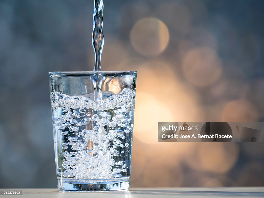 Water being spilt in a glass of crystal