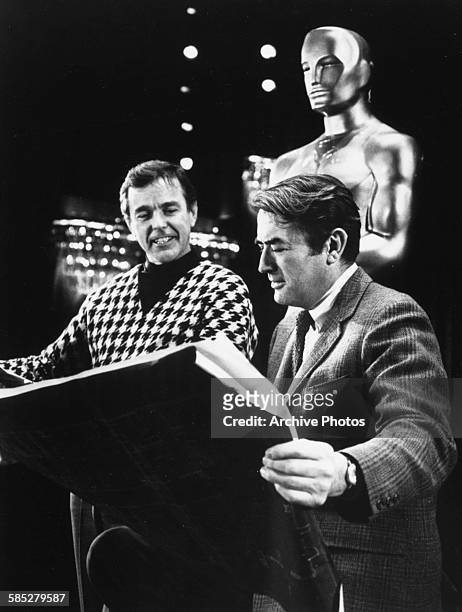Actors Gower Champion and Gregory Peck planning and rehearsing for the 41st Academy Awards show, which will be televised live and in color, Los...