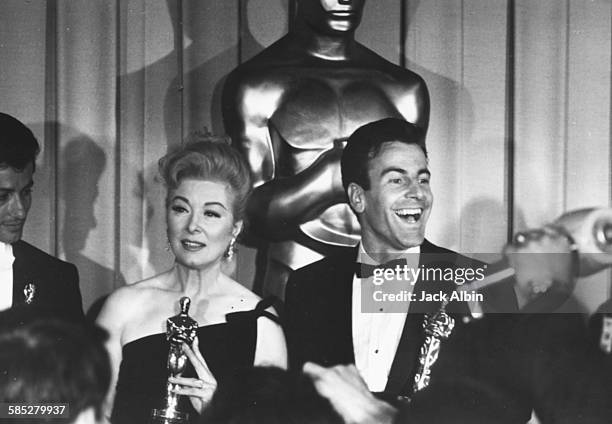 Actors George Chakiris , Greer Garson and Maximilian Schell holding their Oscars at the 39th Academy Awards, Los Angeles, April 9th 1962.