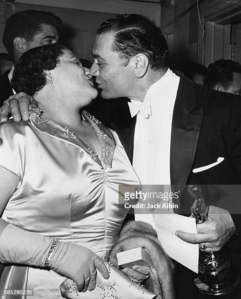 Actor Ernest Borgnine kissing his wife Rhoda after winning the Best Actor Oscar, for the film 'Marty, at the 28th Academy Awards, March 21st 1956.