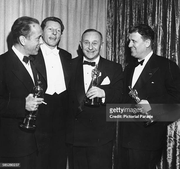 Host Danny Kaye with Oscar winners Humphrey Bogart, Arthur Freed and George Stevens, at the 24th Academy Awards, Los Angeles, March 20th 1952.