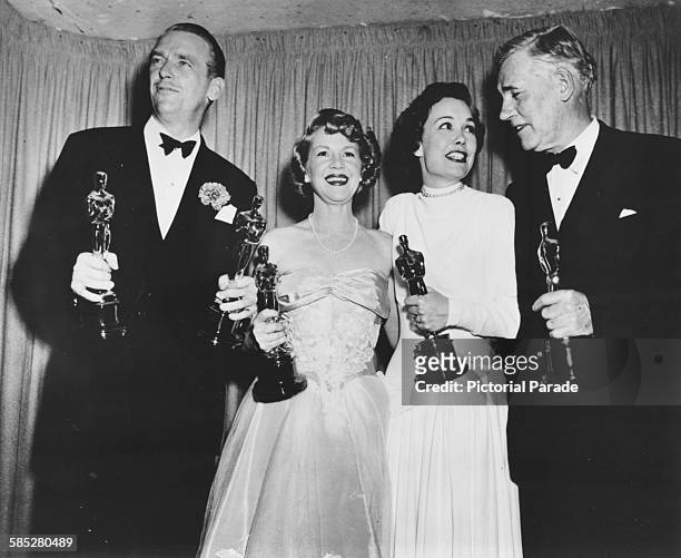 Actors Douglas Fairbanks Jnr, Claire Trevor, Jane Wyman and Walter Huston holding their Oscars, at the 21st Academy Awards, Los Angeles, March 24th...