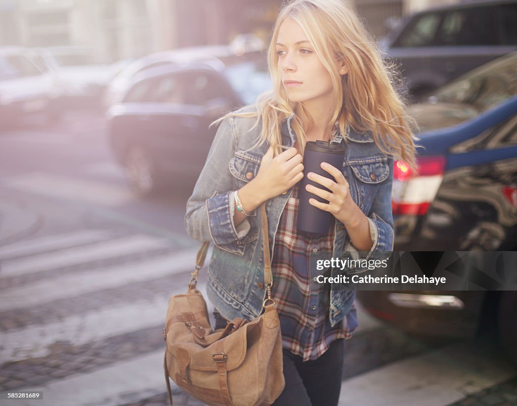 A 18 years old young woman walking in the street