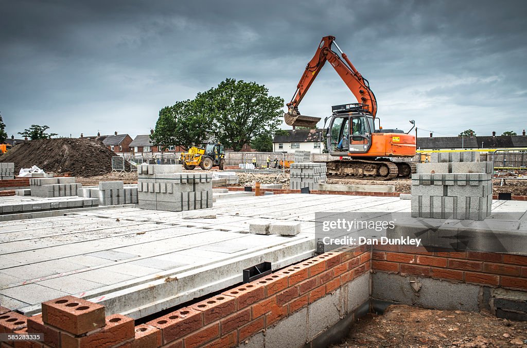 Tractor, building materials on construction site