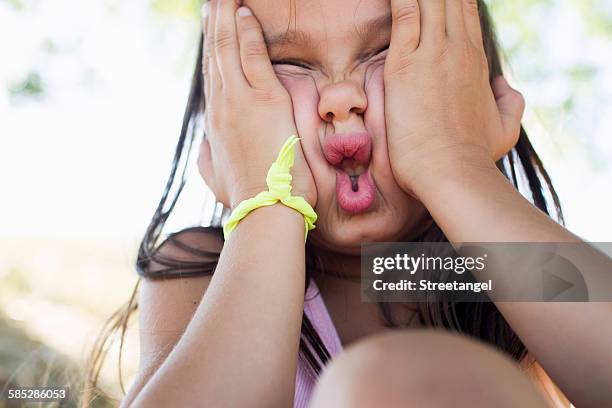 portrait of girl squashing her face - scrunched up face stock pictures, royalty-free photos & images
