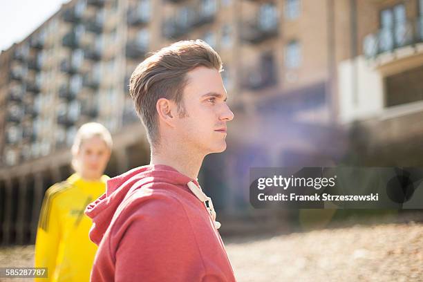 runners standing by building block, wapping, london - coupeville stock pictures, royalty-free photos & images