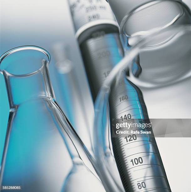 volumetric laboratory glassware used in a chemistry lab, close-up - mätglas bildbanksfoton och bilder