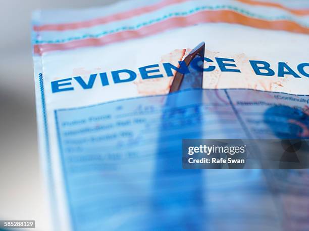 evidence from knife crime incident in forensic bag - police scrutiny stock pictures, royalty-free photos & images