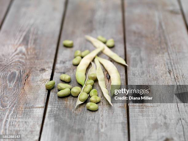 still life of lima beans (also known as butter beans) on wooden table - lima bean stock pictures, royalty-free photos & images