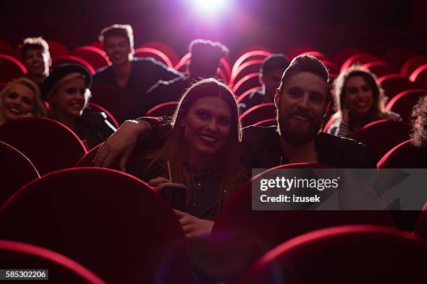 group of people in the cinema - girlfriends films stock pictures, royalty-free photos & images