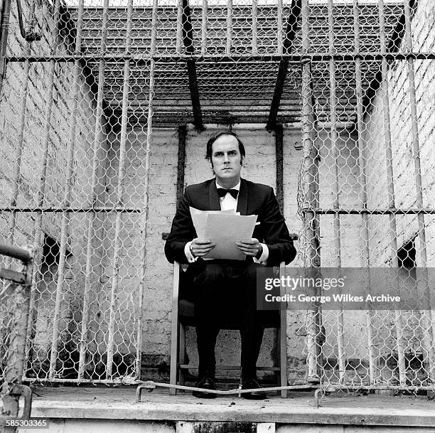 English actor, writer and comedian John Cleese filming a sketch for the television show 'Monty Python's Flying Circus'.