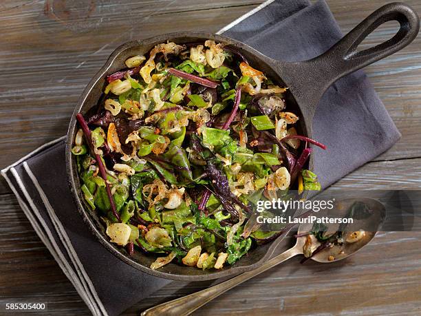 beet leaves sautéed with butter, garlic and onions - sauteren stockfoto's en -beelden